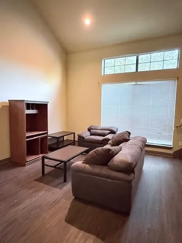 a living room with furniture and window