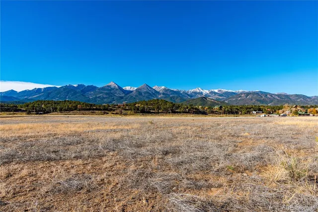 a view of a yard with a mountain view in the background