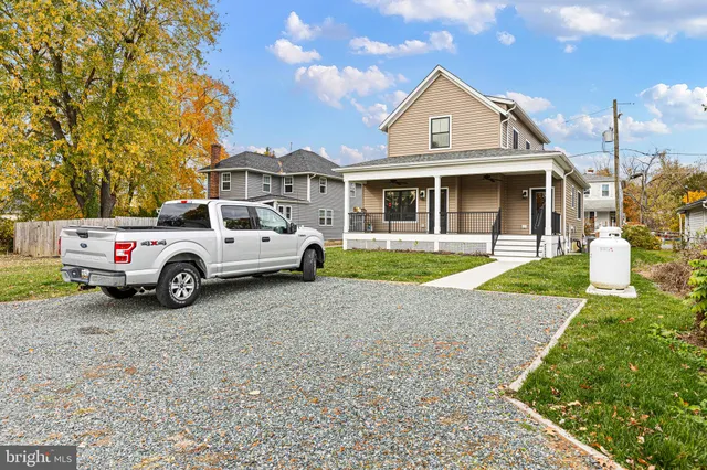 a living room with furniture fireplace and a flat screen tv