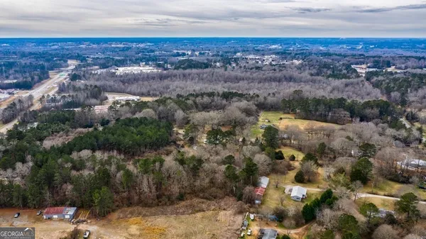 an aerial view of house with yard