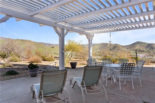 a kitchen with stainless steel appliances granite countertop a sink a stove and cabinets