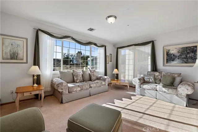 a kitchen with stainless steel appliances granite countertop a stove refrigerator and cabinets
