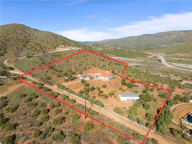 a view of house with yard