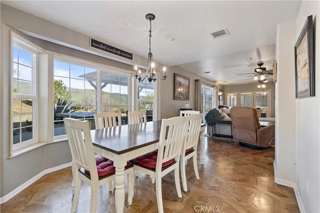 a bathroom with a granite countertop sink a toilet and a shower