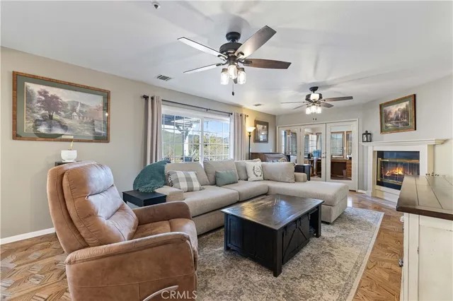 a bed room with furniture and a ceiling fan