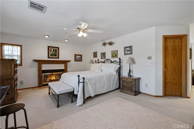 a bedroom with furniture and a window