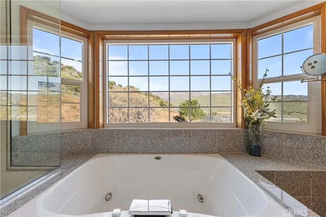 a kitchen with stainless steel appliances granite countertop a refrigerator and a stove