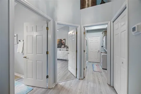 wooden floor with a bathroom and a sink