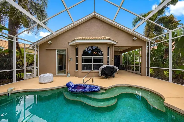 a swimming pool with outdoor seating yard