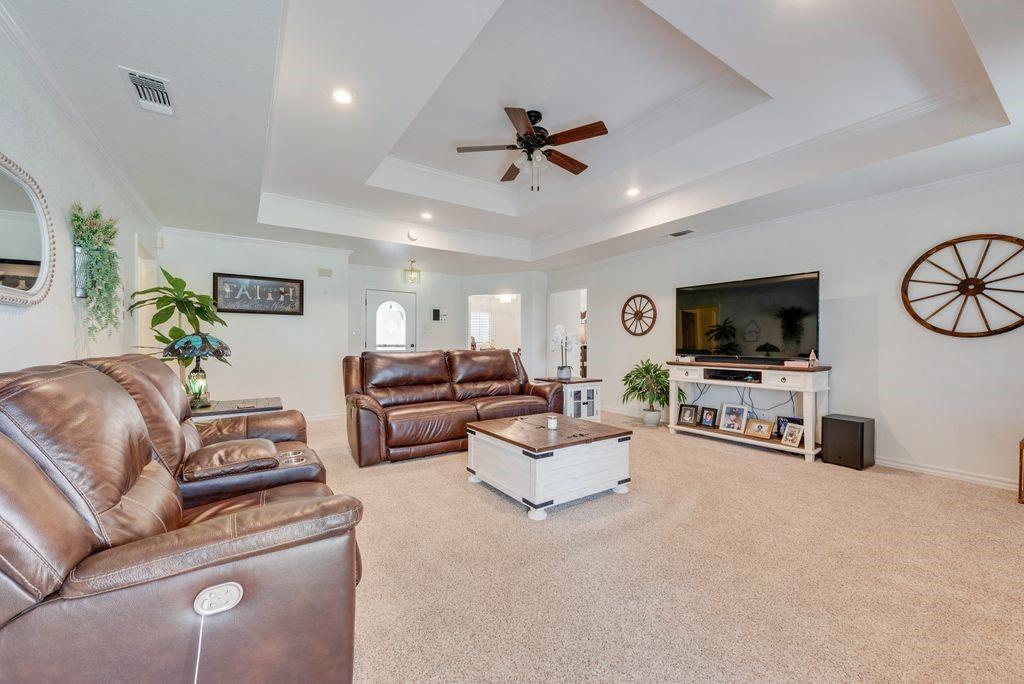 579 South Hitt Street Boyd, TX 76023 - Photo 10 of 34 Large Living Room with Tray Ceiling and Woof Burning Fire Place