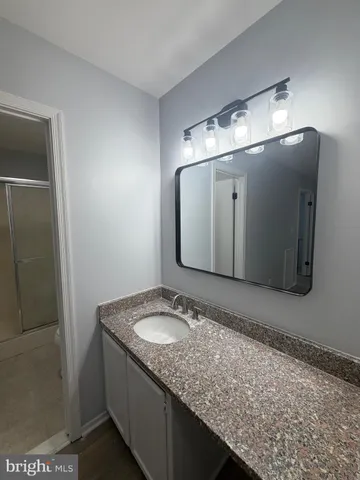 a white toilet sitting next to a bathroom sink