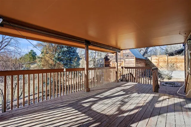 a balcony with wooden floor