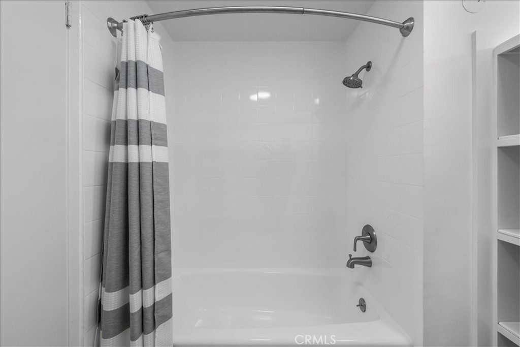 10802 Deshire Place Culver City, CA 90230 - Photo 18 of 50 a bathroom with a bathtub and shower