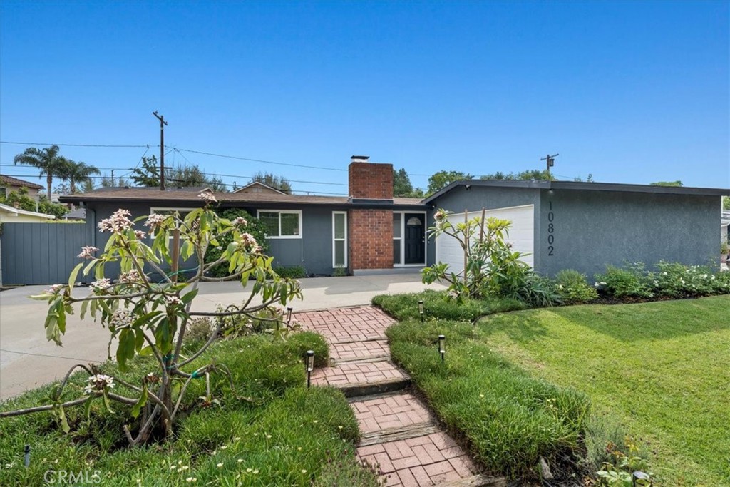 10802 Deshire Place Culver City, CA 90230 - Photo 2 of 50 a front view of a house with a garden