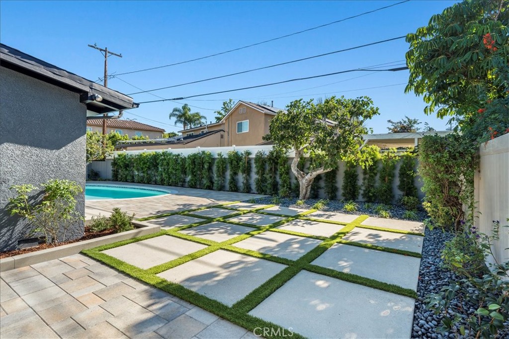 10802 Deshire Place Culver City, CA 90230 - Photo 27 of 50 a view of a swimming pool with a patio