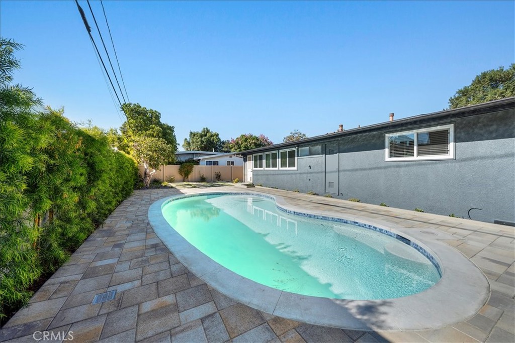 10802 Deshire Place Culver City, CA 90230 - Photo 32 of 50 a view of a swimming pool with a yard