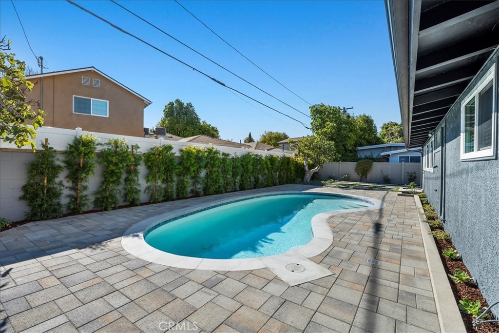10802 Deshire Place Culver City, CA 90230 - Photo 33 of 50 a view of a swimming pool with a patio