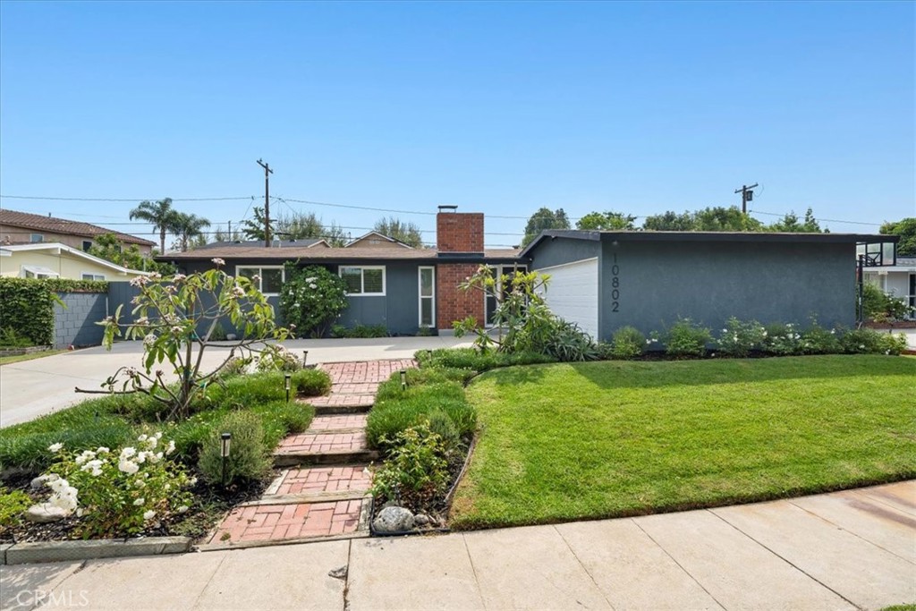 10802 Deshire Place Culver City, CA 90230 - Photo 48 of 50 a front view of a house with a garden