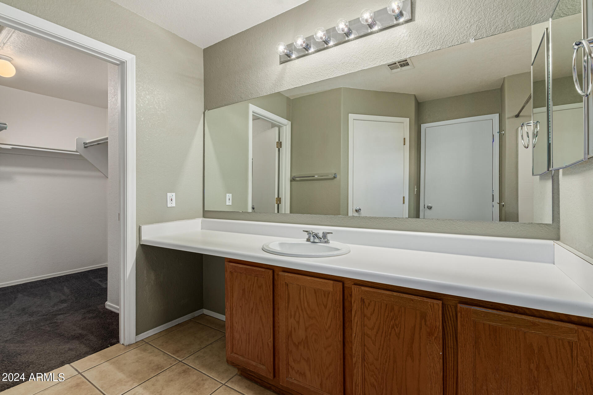1371 South Boulder Street, Unit A Gilbert, AZ 85296 - Photo 24 of 43 a bathroom with a sink and a mirror