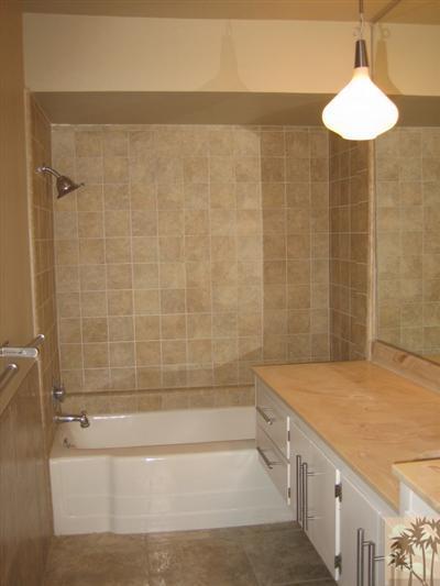 79350 4 Paths Lane Bermuda Dunes, CA 92203 - Photo 11 of 24 a bathroom with a bathtub and a shower