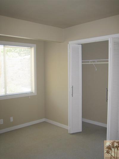 79350 4 Paths Lane Bermuda Dunes, CA 92203 - Photo 12 of 24 an empty room with a window