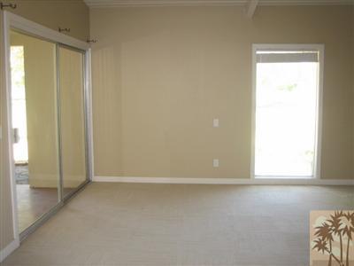 79350 4 Paths Lane Bermuda Dunes, CA 92203 - Photo 13 of 24 an empty room with windows