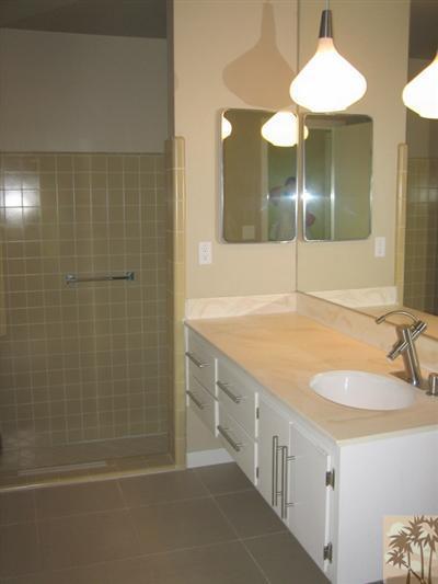 79350 4 Paths Lane Bermuda Dunes, CA 92203 - Photo 15 of 24 a bathroom with a double vanity sink and a mirror