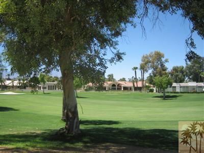 79350 4 Paths Lane Bermuda Dunes, CA 92203 - Photo 22 of 24 a view of a golf course with a garden