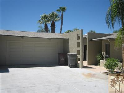 79350 4 Paths Lane Bermuda Dunes, CA 92203 - Photo 3 of 24 a potted plant sitting on the side of a building