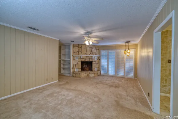 a view of an empty room with a window