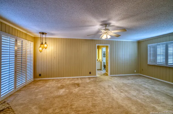 a bathroom with a double vanity sink toilet and a mirror