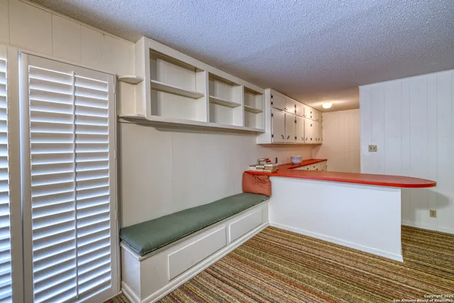 a bathroom with a toilet a sink and shower