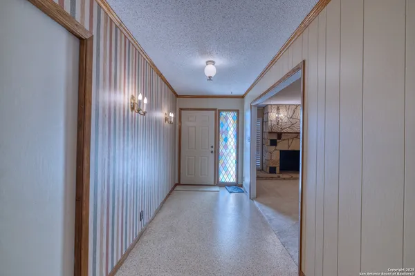 a kitchen with stainless steel appliances granite countertop a sink a stove and a refrigerator