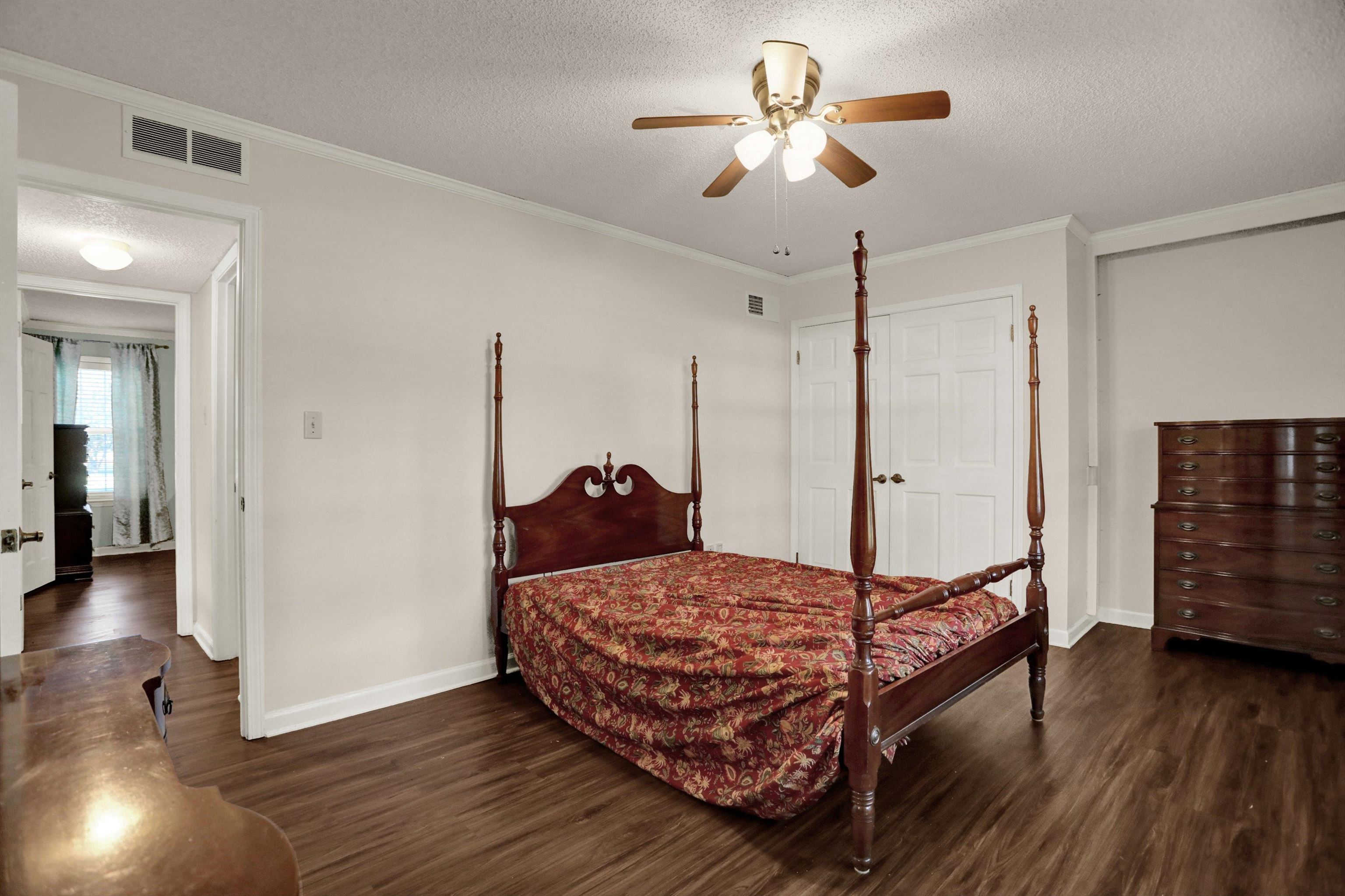 11670 Macon Road Eads, TN 38028 - Photo 20 of 40 a bedroom with a bed and wooden floor