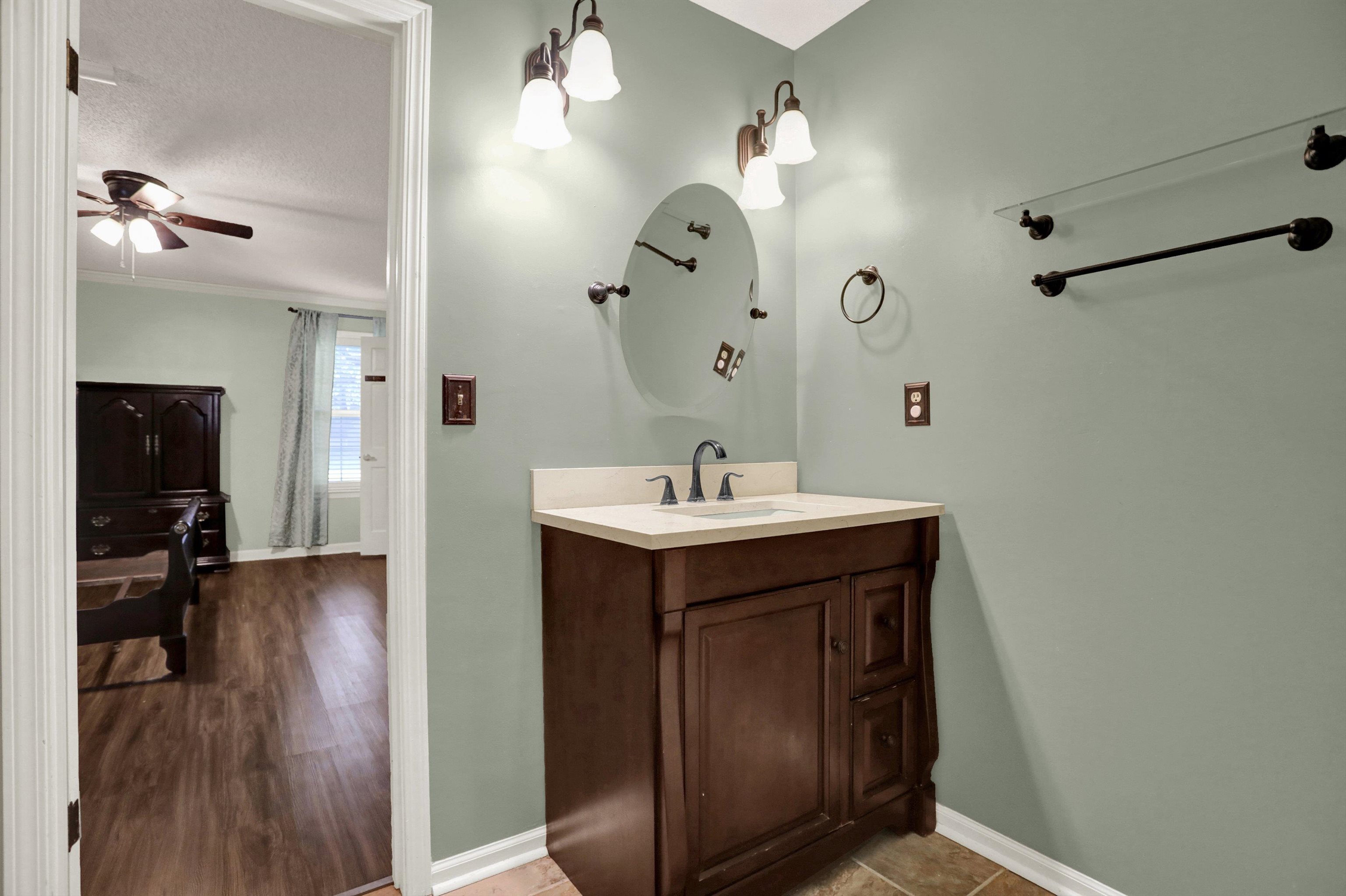 11670 Macon Road Eads, TN 38028 - Photo 22 of 40 a bathroom with a sink and a mirror