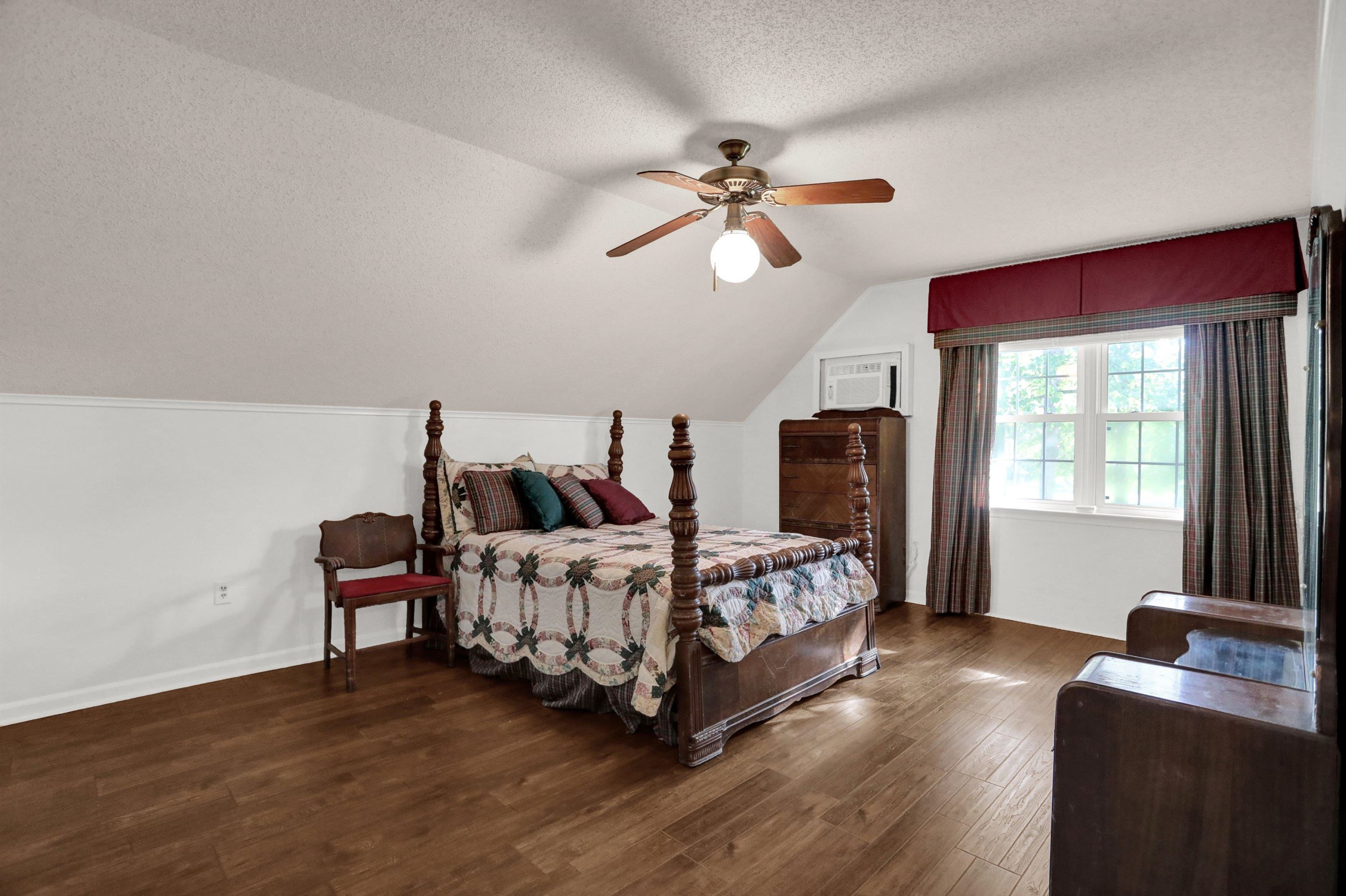 11670 Macon Road Eads, TN 38028 - Photo 24 of 40 a bedroom with a bed and wooden floor