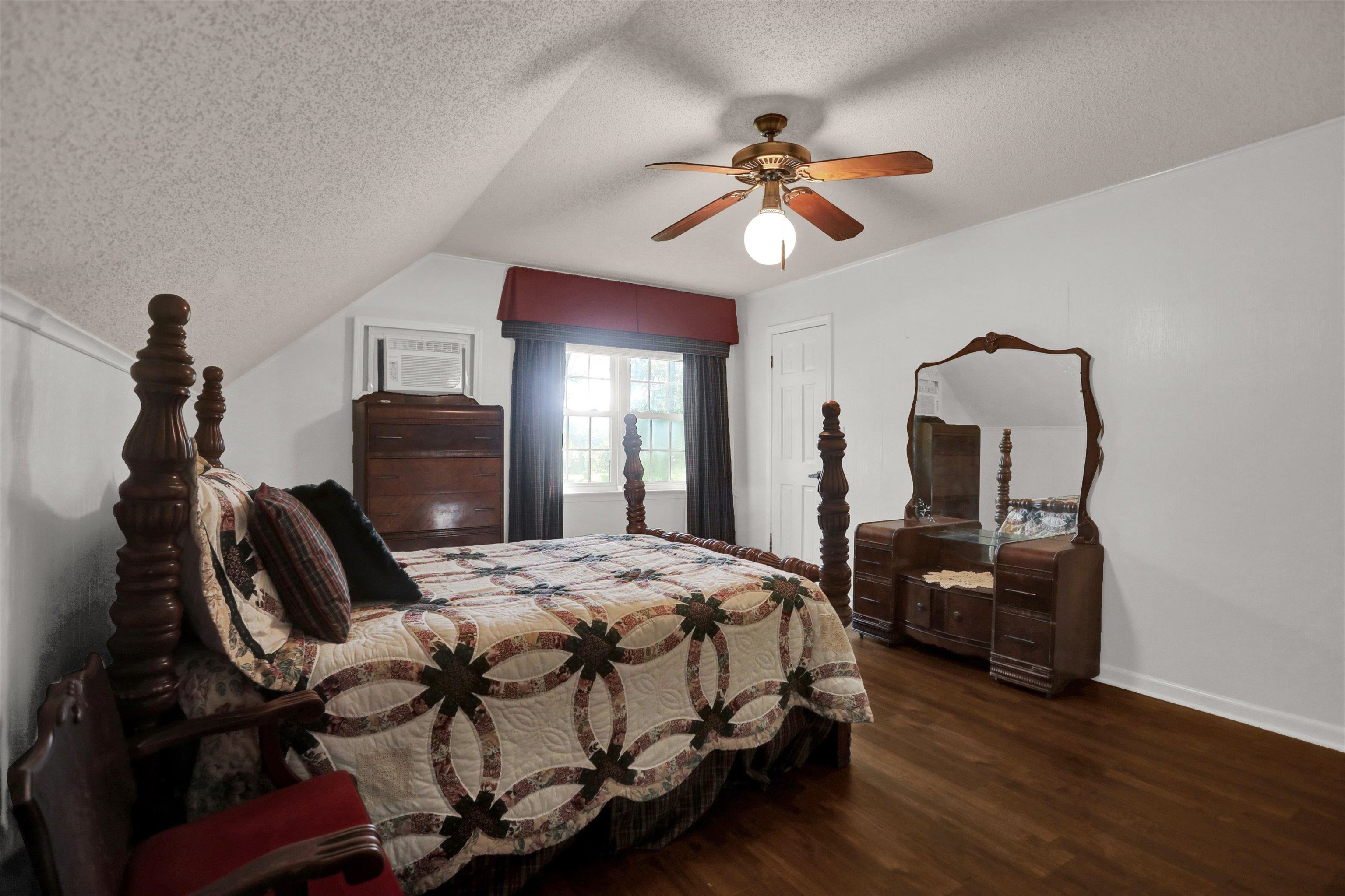 11670 Macon Road Eads, TN 38028 - Photo 25 of 40 a bedroom with a bed and wooden floor