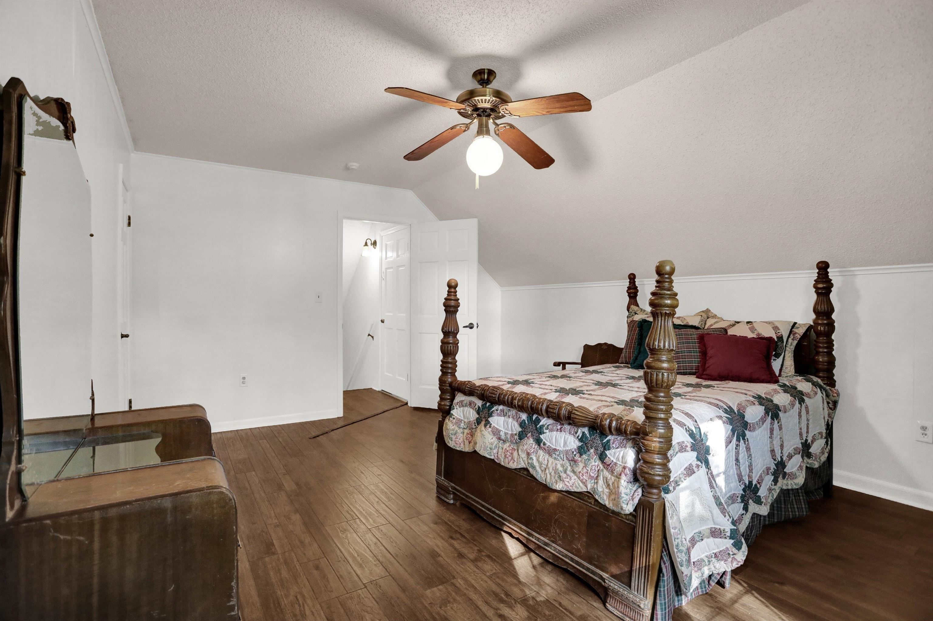 11670 Macon Road Eads, TN 38028 - Photo 26 of 40 a bedroom with a bed and a chandelier