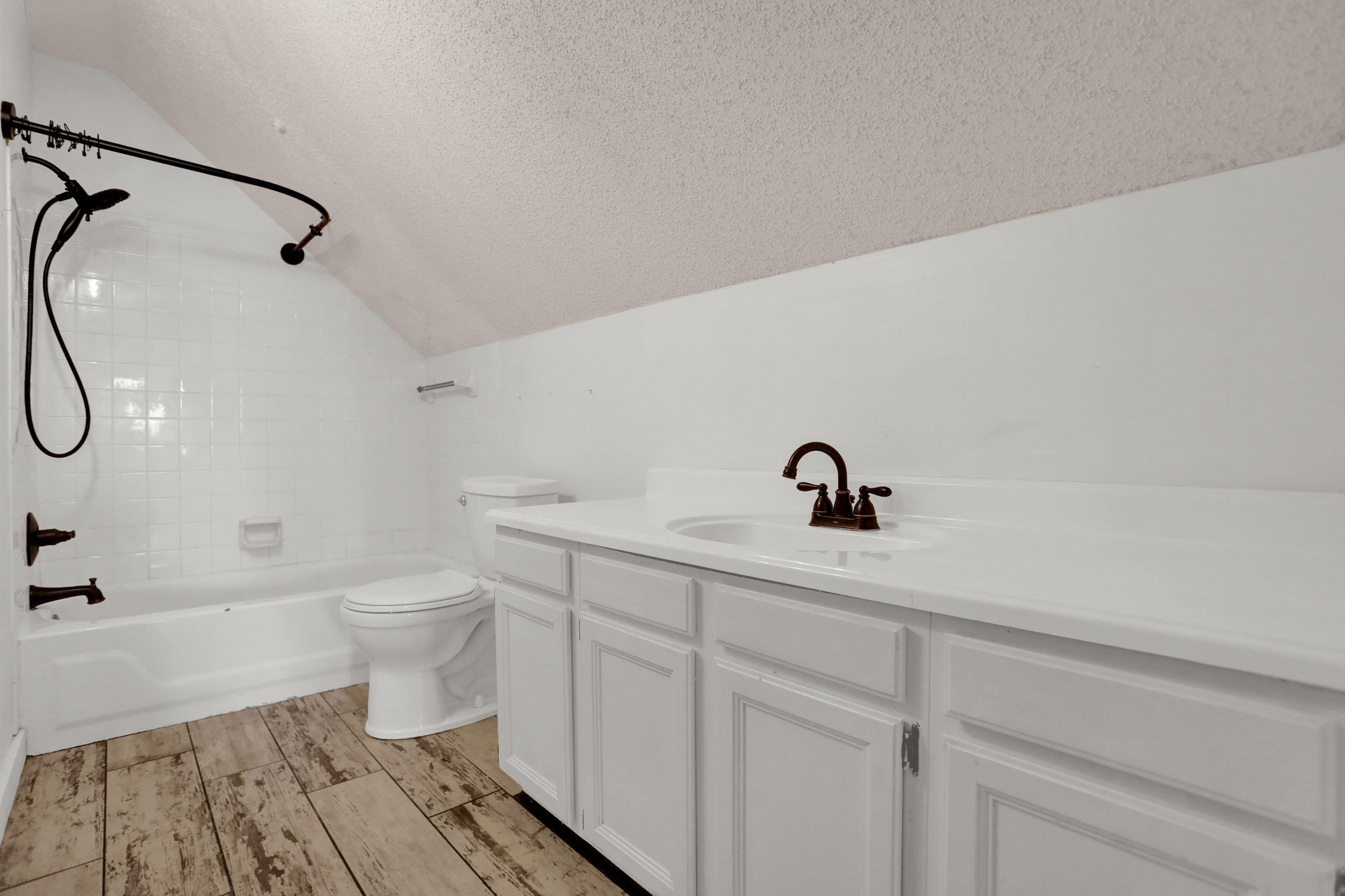 11670 Macon Road Eads, TN 38028 - Photo 29 of 40 a bathroom with a sink a toilet and a bathtub