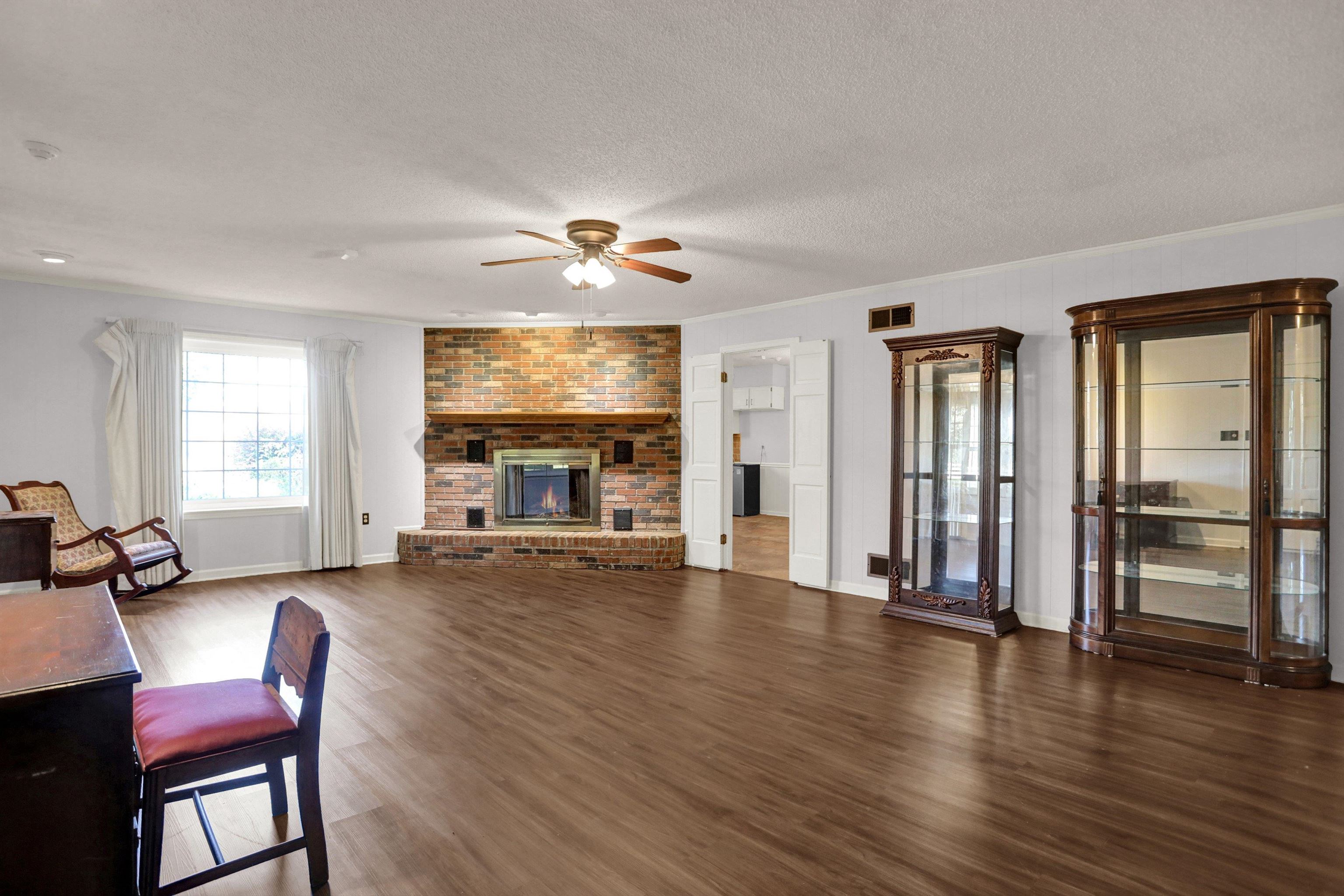 11670 Macon Road Eads, TN 38028 - Photo 6 of 40 a view of a livingroom with furniture wooden floor and windows