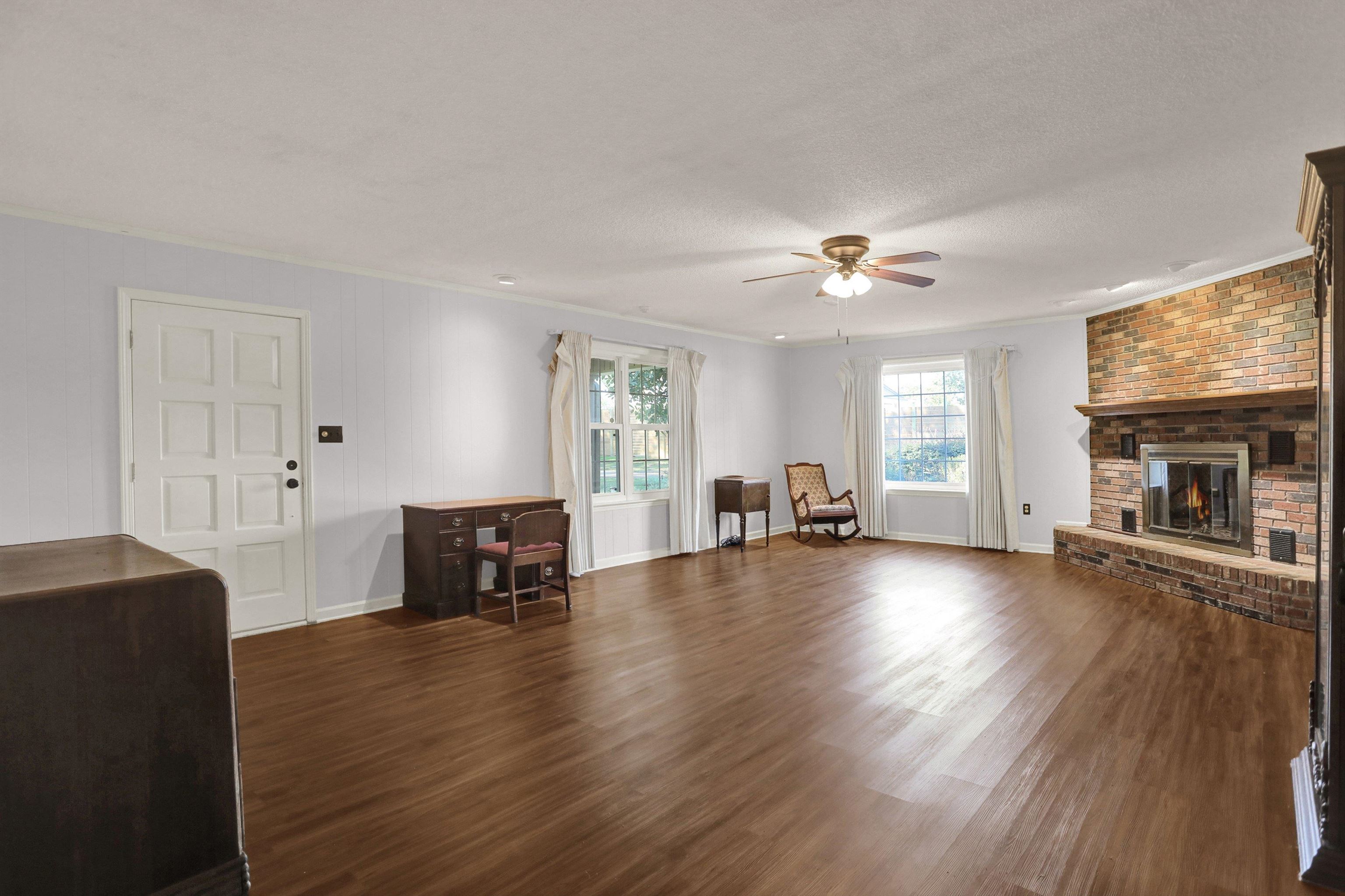 11670 Macon Road Eads, TN 38028 - Photo 7 of 40 a view of livingroom with hardwood floor and a ceiling fan