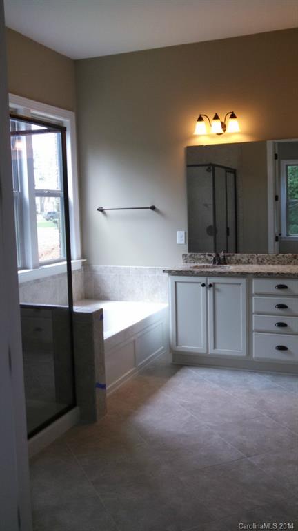 8145 Clems Branch Road Indian Land, SC 29707 - Photo 9 of 14 a kitchen with a cabinets and chandelier
