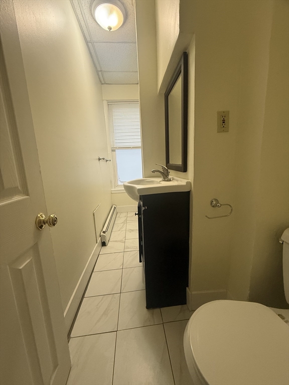 48 Florence Street, Unit 2 Somerville, MA 02145 - Photo 4 of 11 a bathroom with a sink and toilet