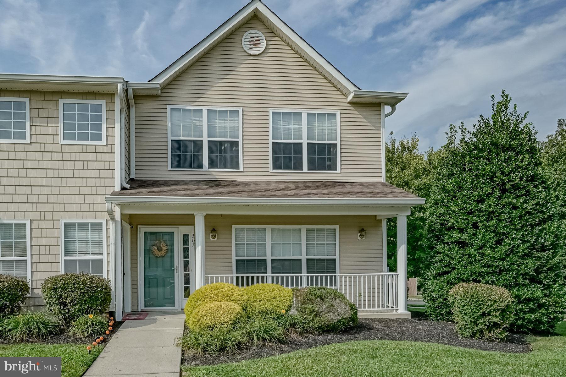 front view of a house and a yard