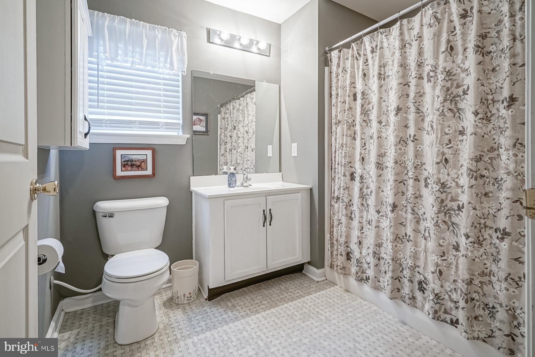307 Red Bud Lane Mantua, NJ 08051 - Photo 11 of 21 a bathroom with a toilet sink and mirror