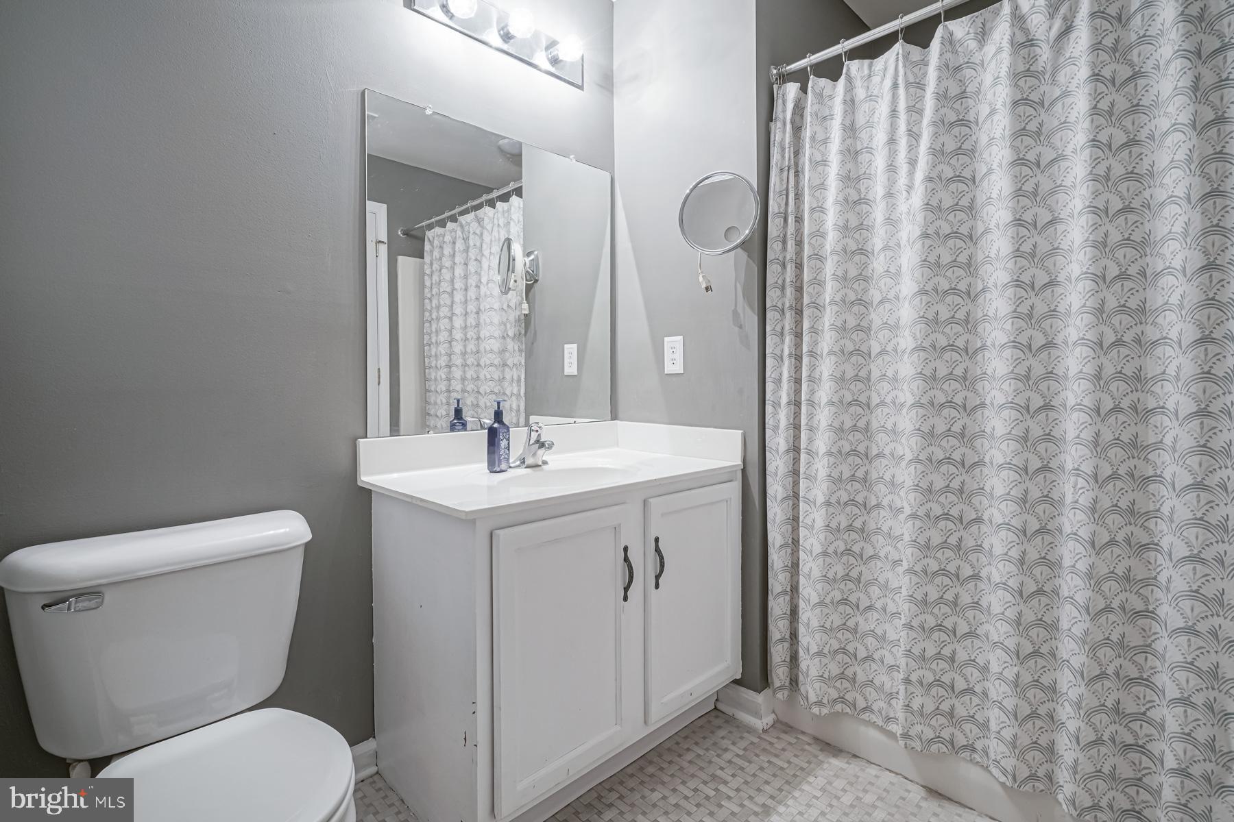 307 Red Bud Lane Mantua, NJ 08051 - Photo 16 of 21 a bathroom with a toilet sink and mirror