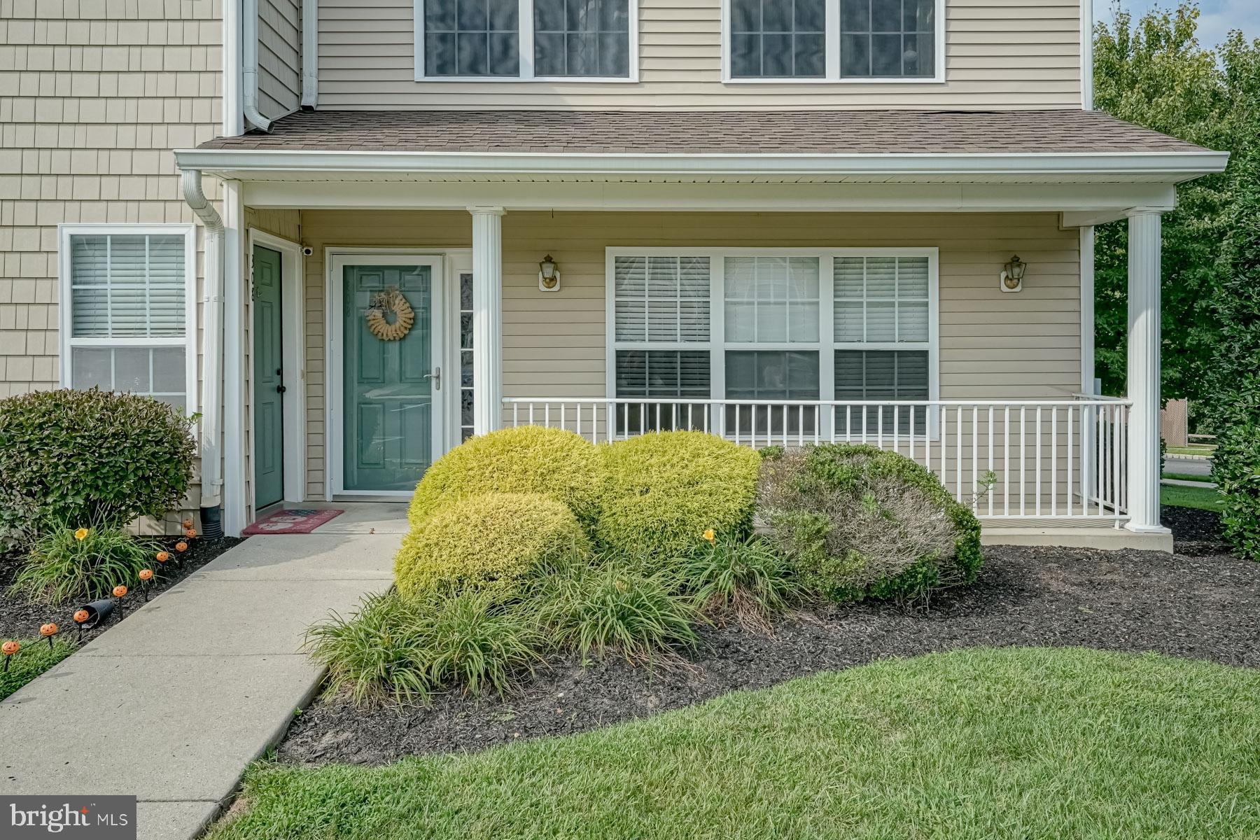 307 Red Bud Lane Mantua, NJ 08051 - Photo 2 of 21 a front view of a house with a garden