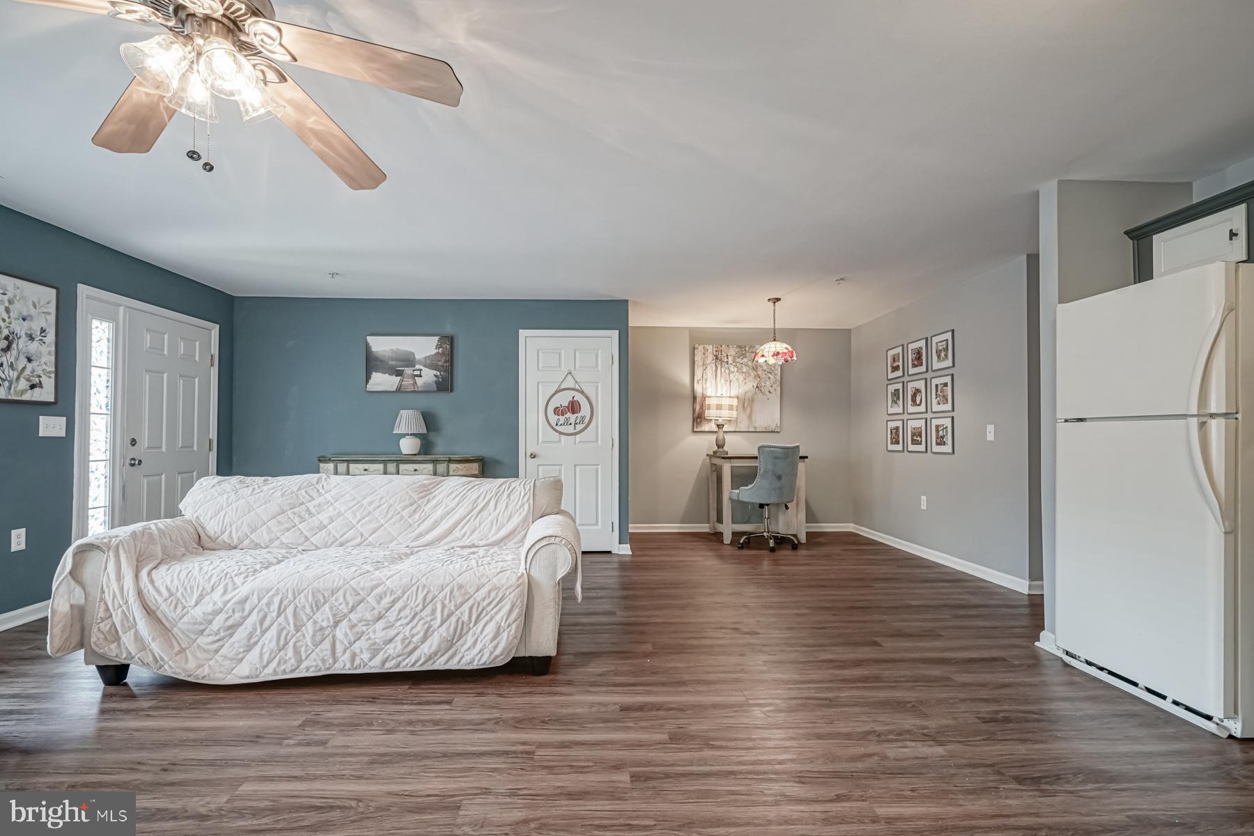 307 Red Bud Lane Mantua, NJ 08051 - Photo 6 of 21 a living room with furniture and a chandelier