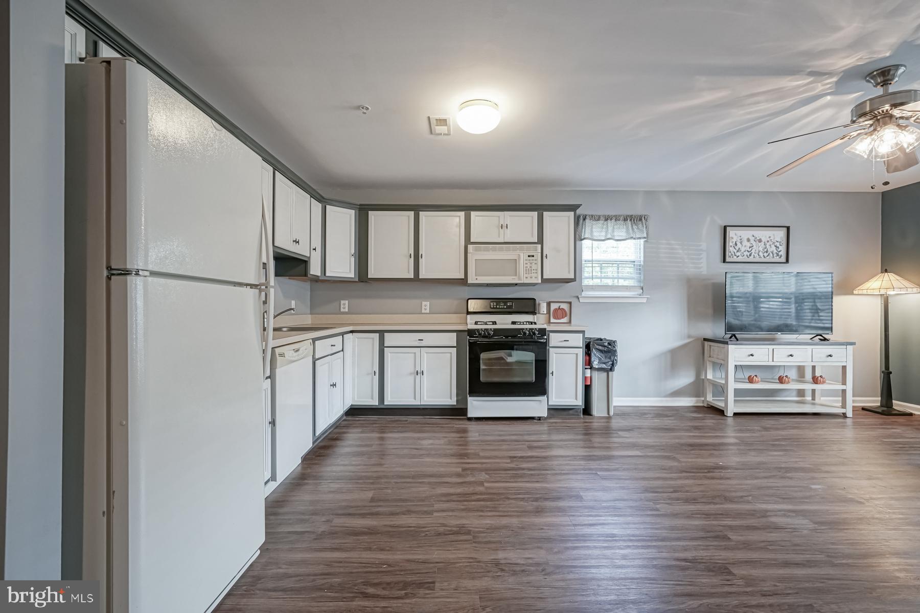 307 Red Bud Lane Mantua, NJ 08051 - Photo 8 of 21 a kitchen with stainless steel appliances a refrigerator sink and cabinets