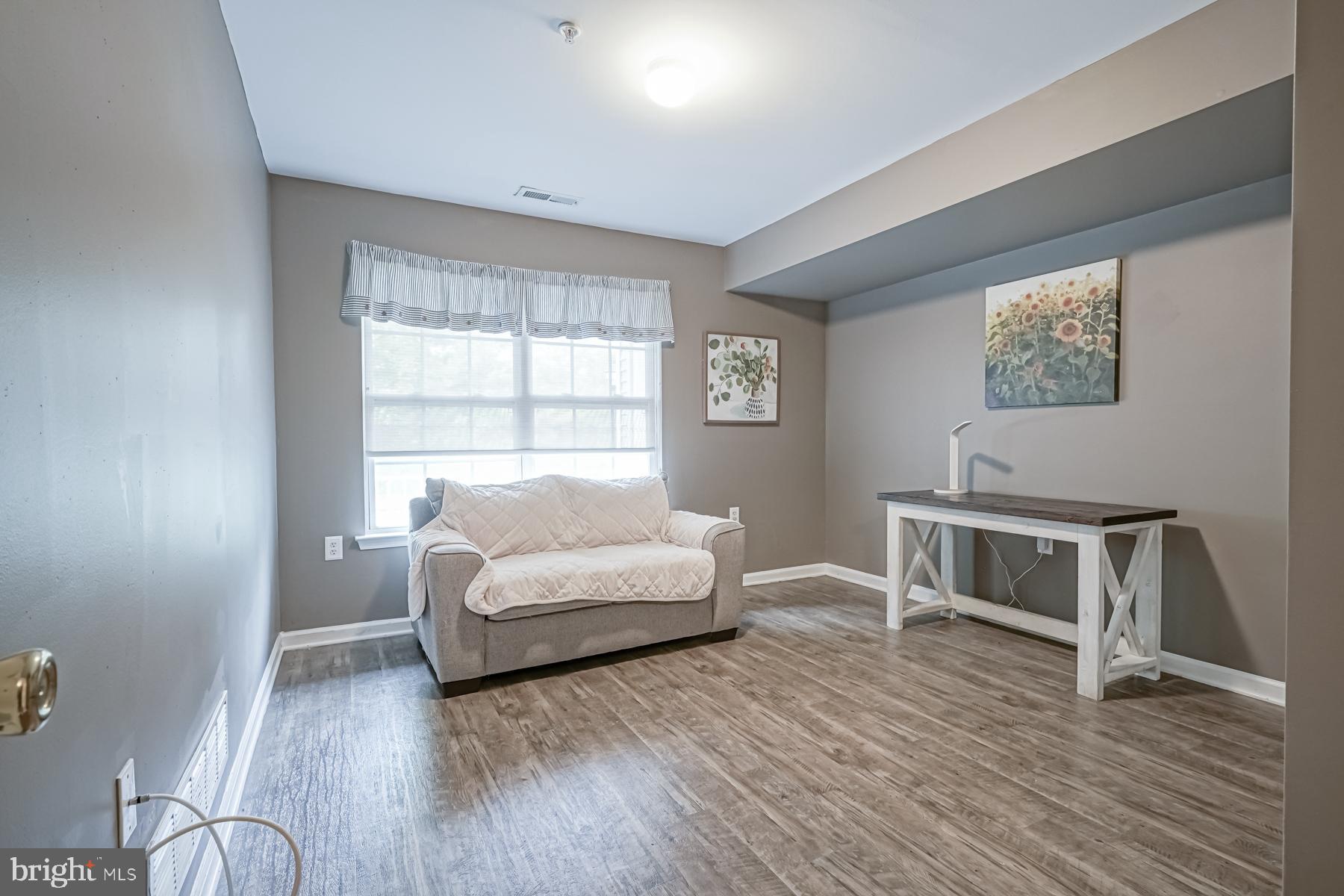 307 Red Bud Lane Mantua, NJ 08051 - Photo 10 of 21 a living room with furniture and a wooden floor